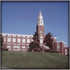 A high school building with a clock tower

AI-generated content may be incorrect.